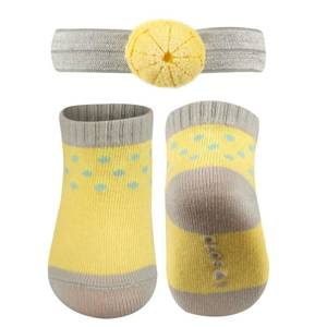 Yellow SOXO baby set of socks with a headband