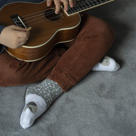 Warm SOXO gray children's socks, a teddy bear with warm terry cloths